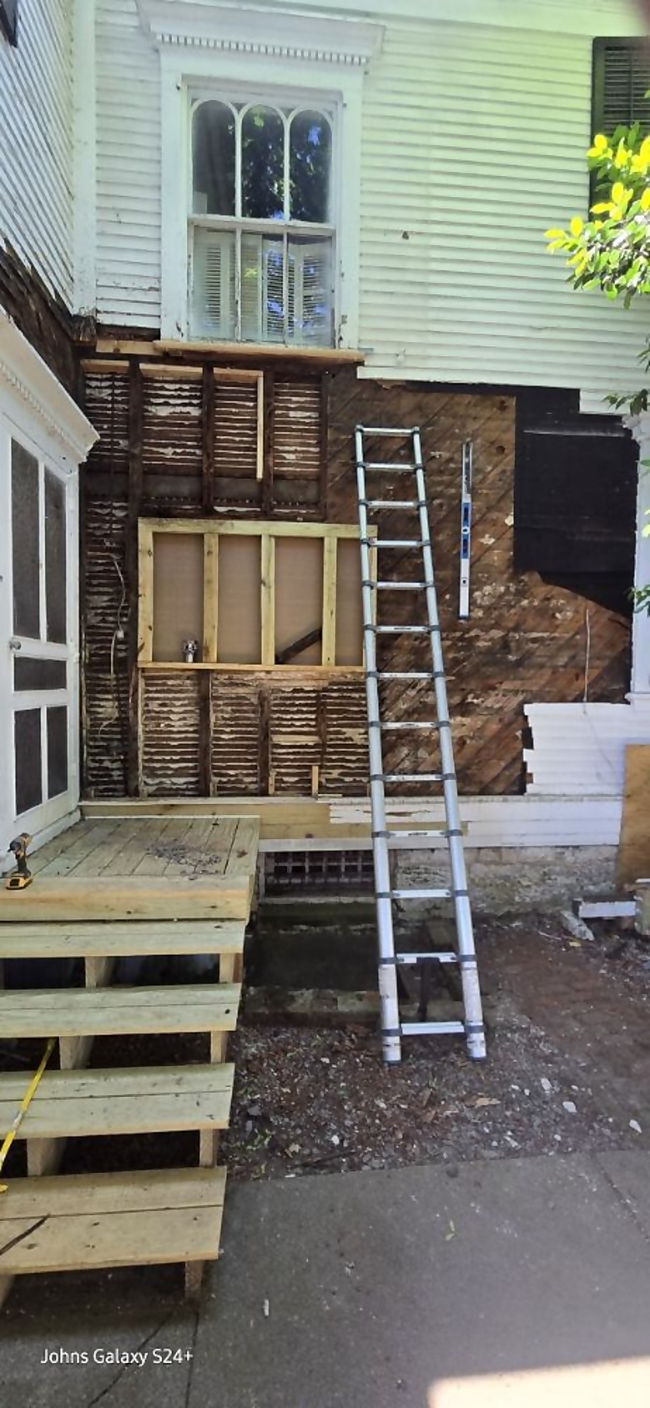 Exterior wall opened for structural repair before new siding is installed