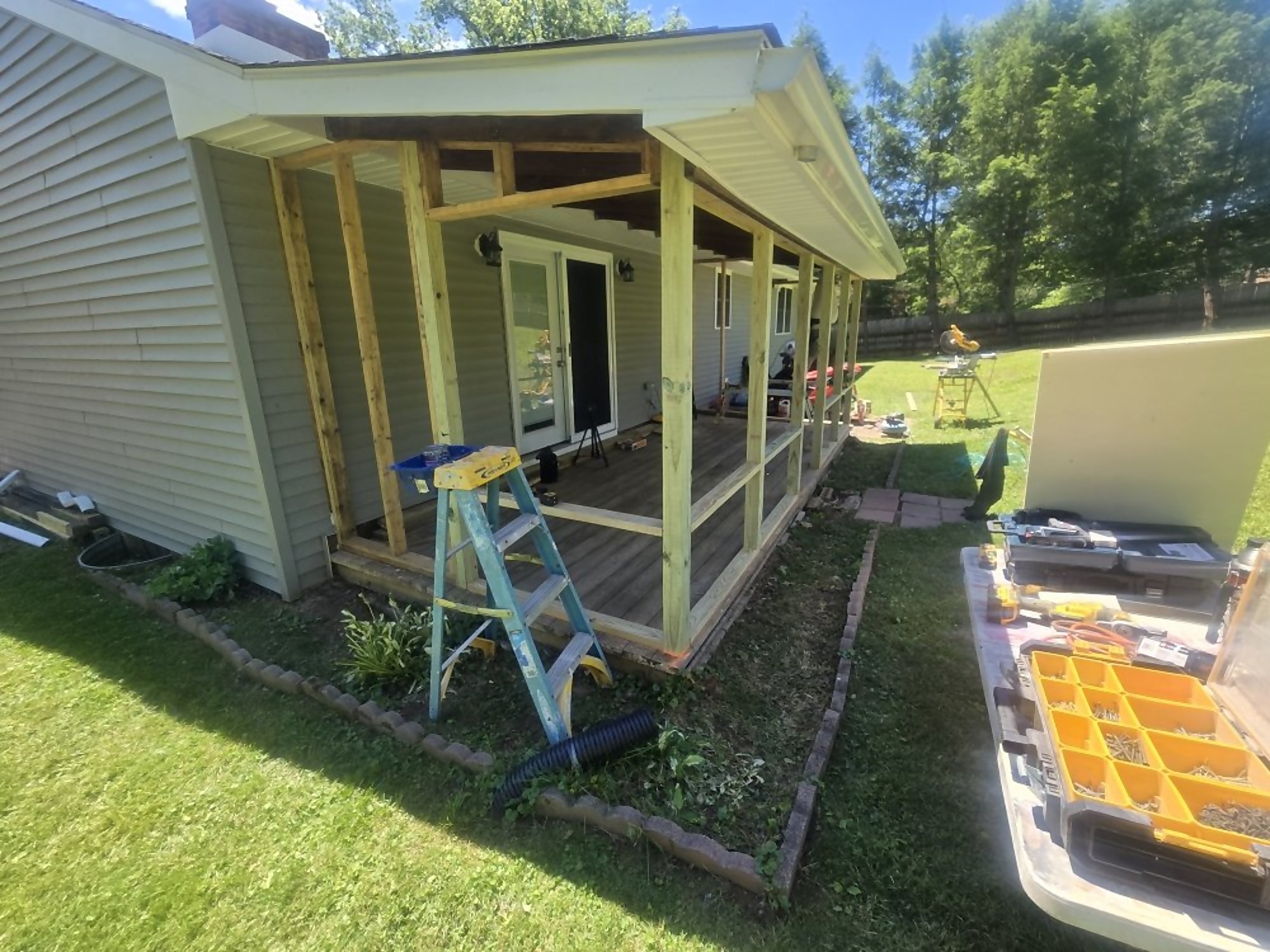 Exterior framing of a covered porch addition built by Pro One