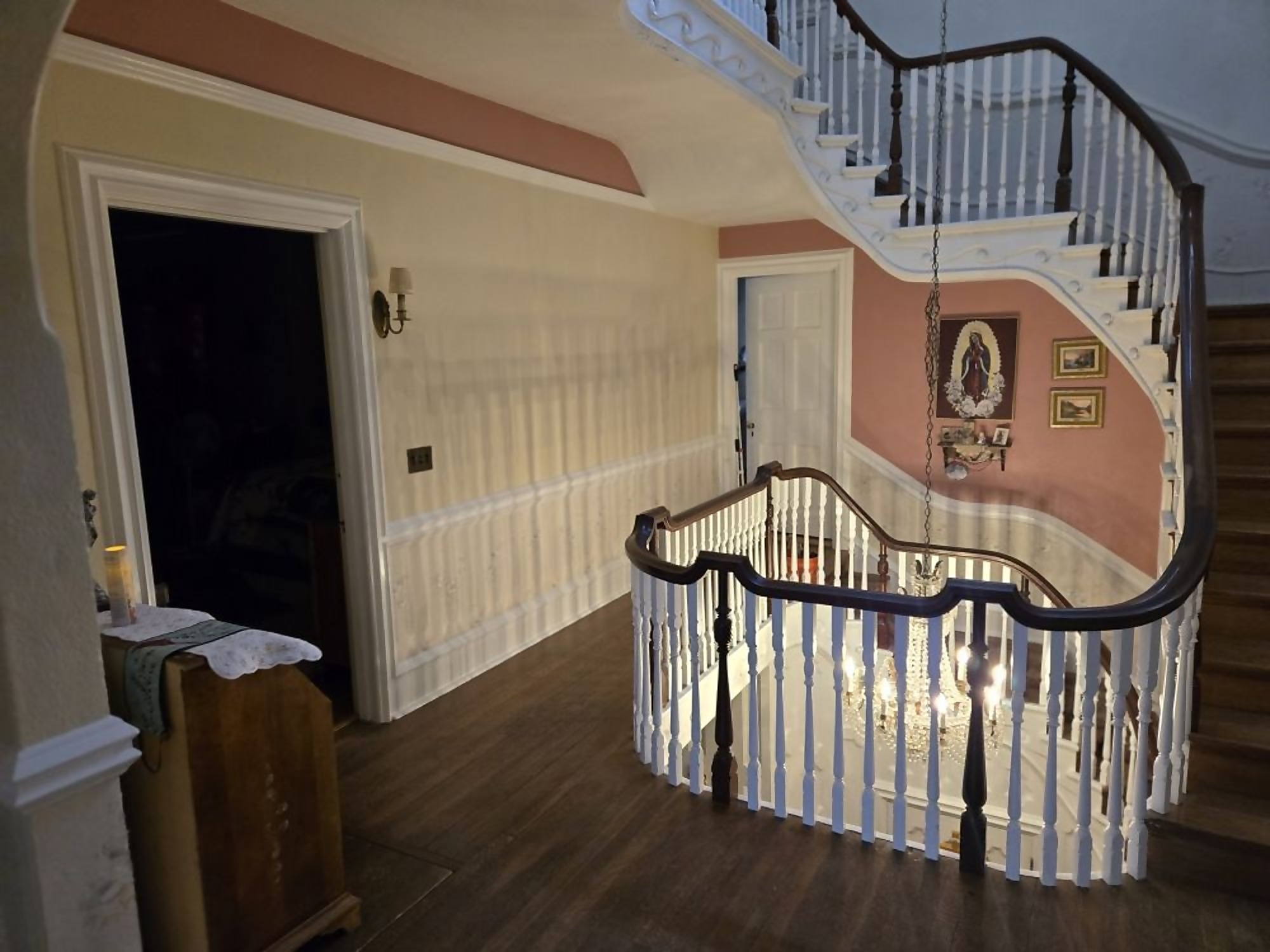 Curved staircase and foyer refinished with new paint and flooring