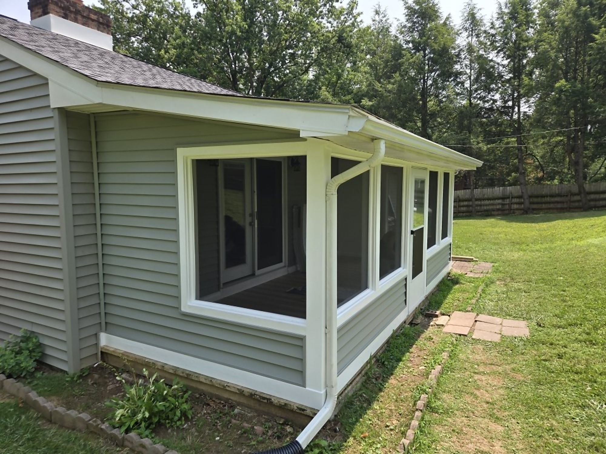 Finished three-season room addition with trim and siding by Pro One